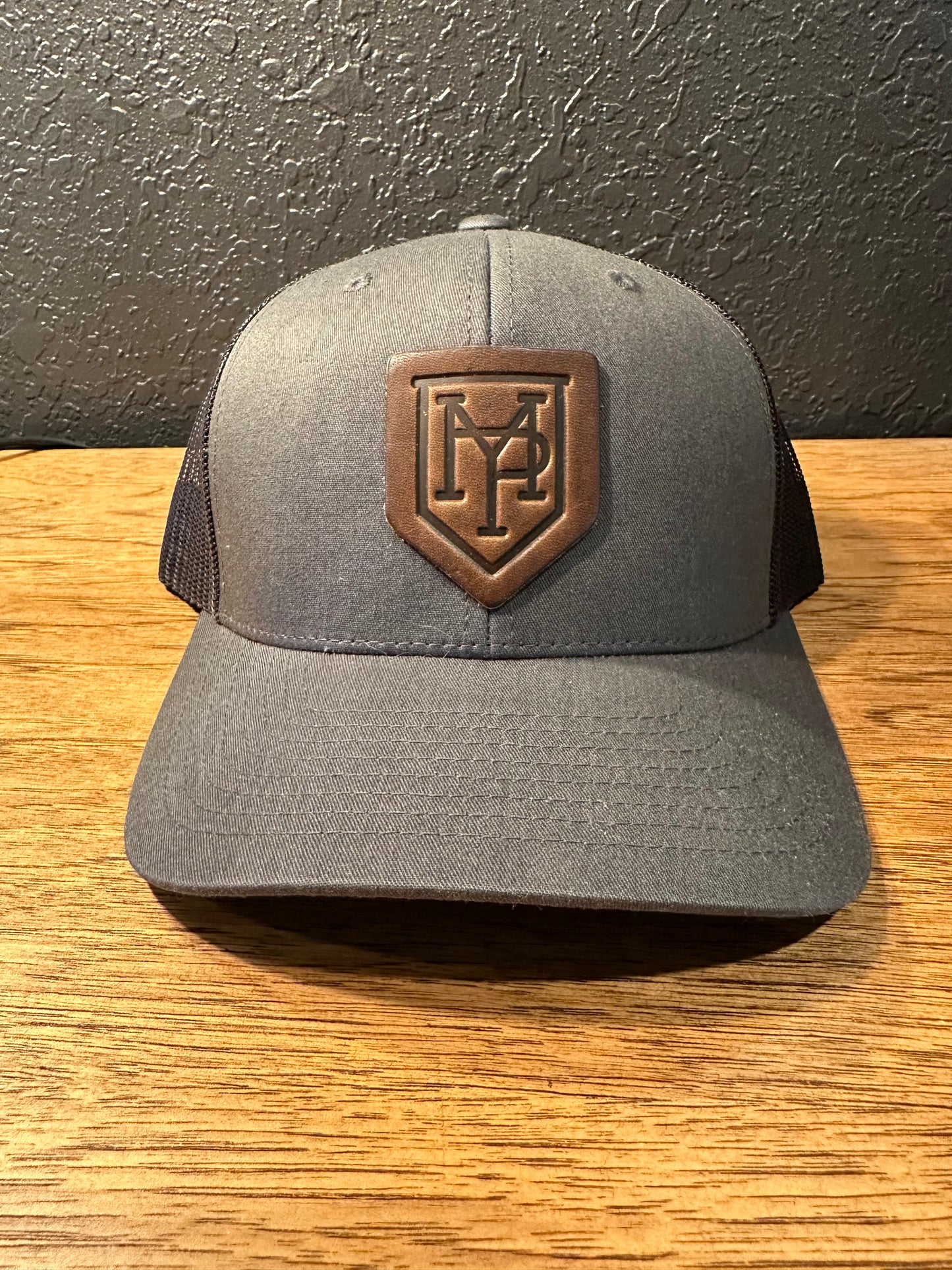 Charcoal Cap MP Logo